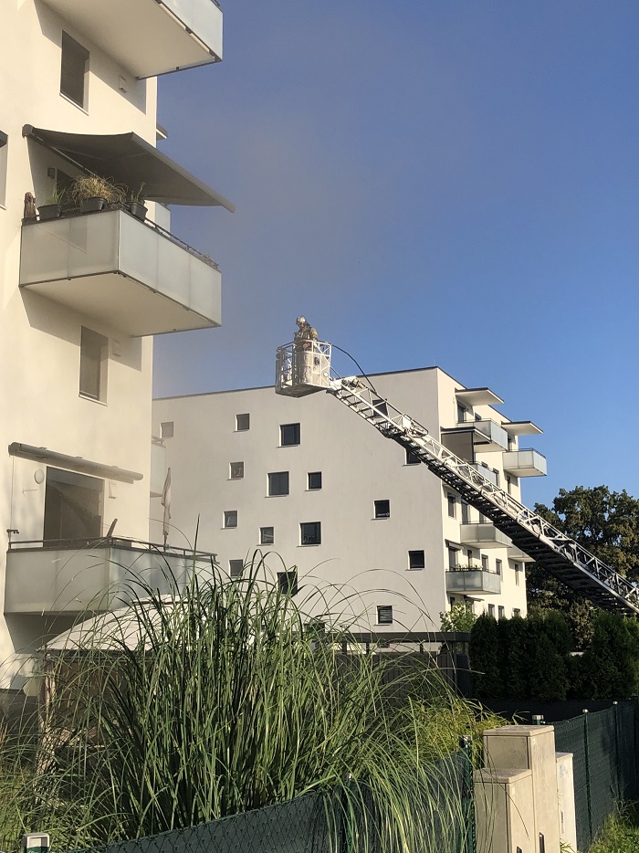 An alert neighbor notices a fire in a room